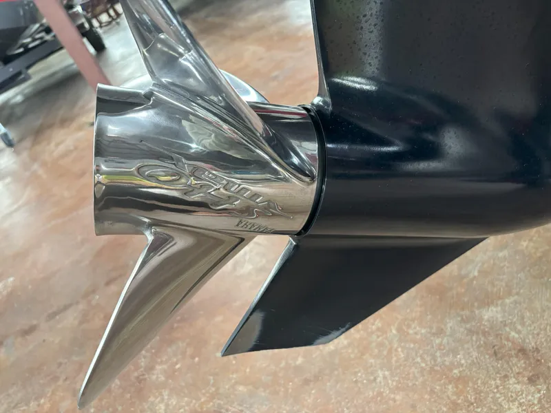 Slide: The Image of Close-up of a 2021 Skeeter ZXR21 boat propeller, showcasing its sleek metallic design. - 12
