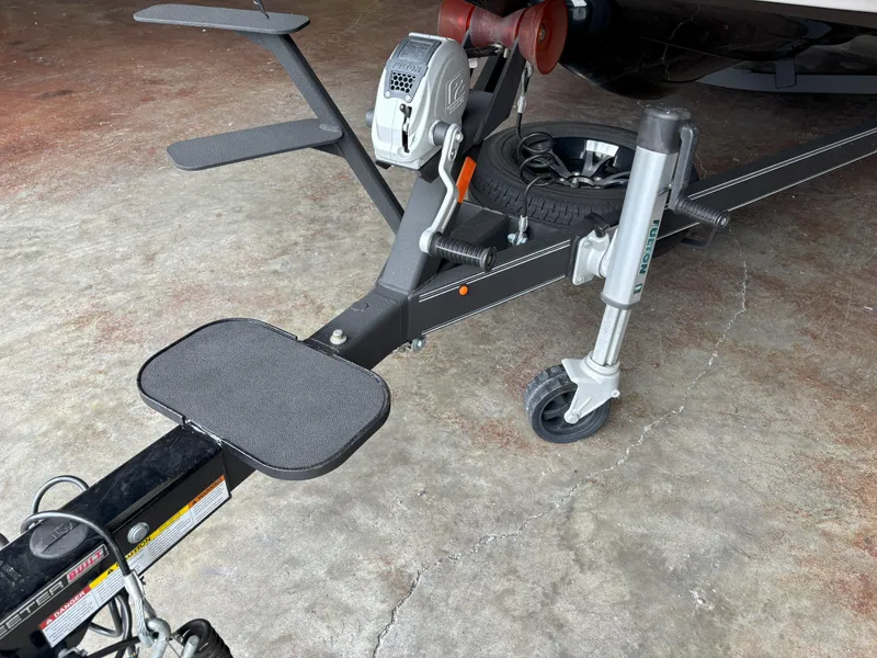 Slide: The Image of Trailer hitch and wheel assembly of a 2021 Skeeter ZXR21 boat. - 14