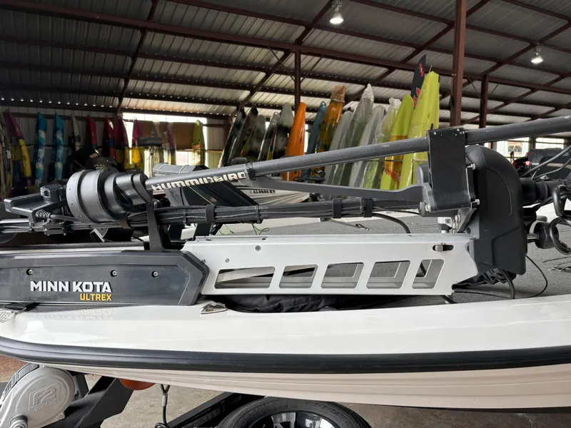 Slide: The Image of 2021 Skeeter ZXR21 boat with Minn Kota Ultrex motor in a showroom. - 20