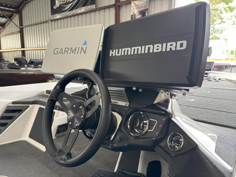 Slide: The Image of 2021 Skeeter ZXR21 boat dashboard with Garmin and Humminbird displays. - 24