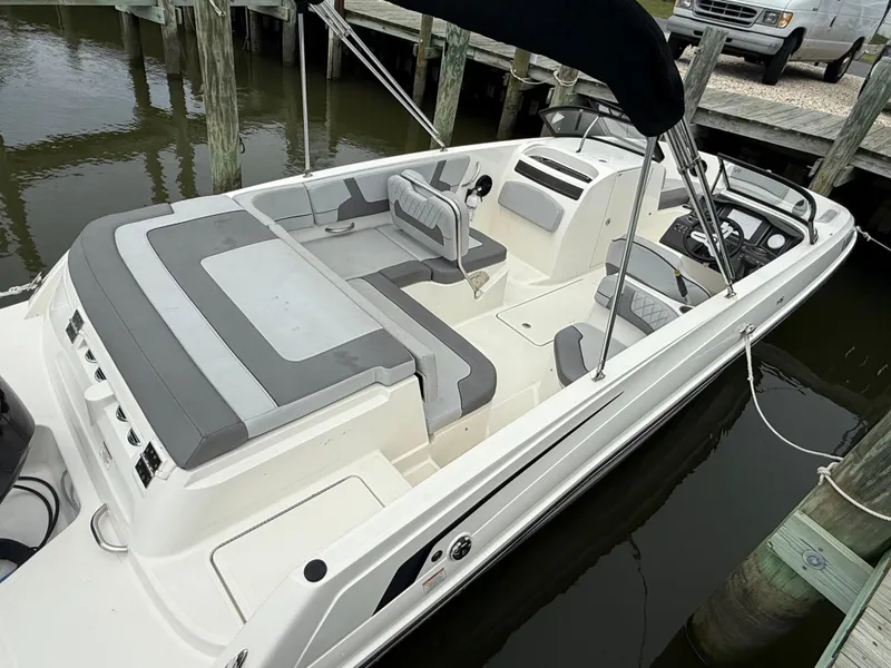 Slide: The Image of 2023 Bayliner VR6 Bowrider OB docked, featuring spacious seating and sleek design. - 5