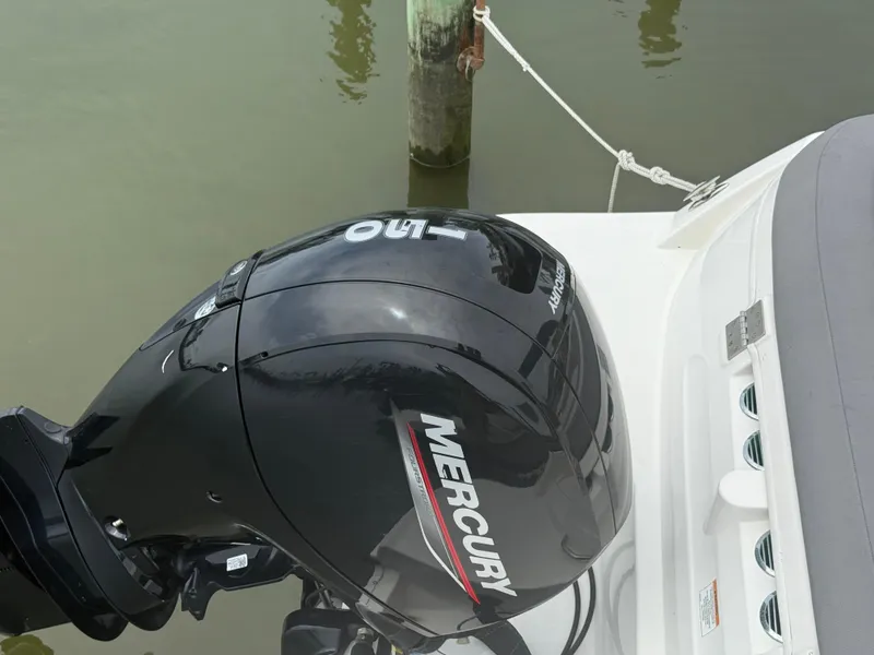 Slide: The Image of 2023 Bayliner VR6 Bowrider OB with Mercury outboard motor, docked by a wooden post. - 6