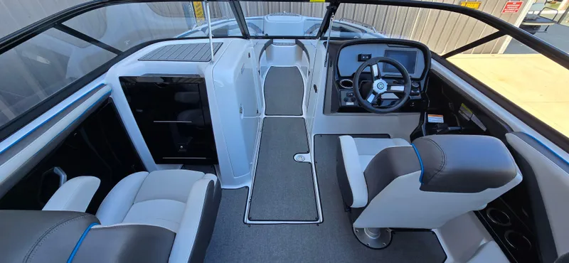 Slide: The Image of 2020 Yamaha Boats AR240 interior with modern helm, seating, and sleek design. - 8