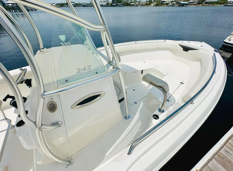 Slide: The Image of 2022 Sailfish 242 CC boat with sleek design, spacious seating, and stainless steel railings. - 17