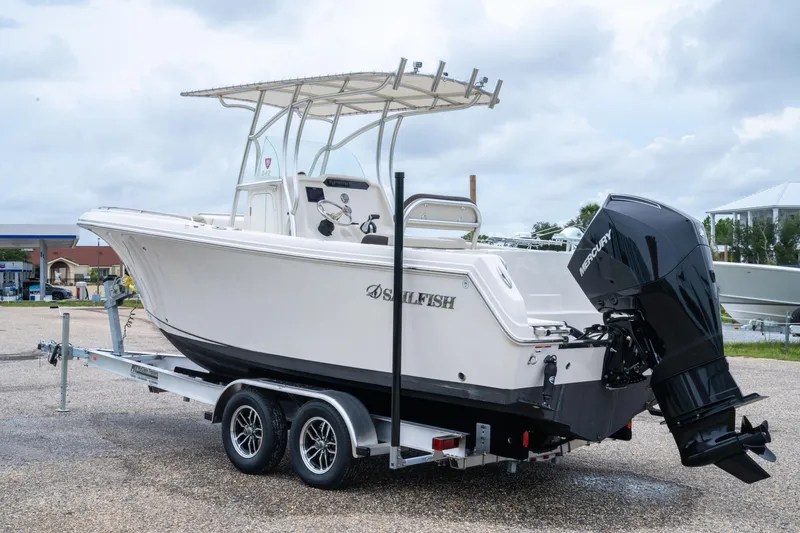 Slide: The Image of 2022 Sailfish 242 CC boat on trailer with Mercury outboard motor. - 2