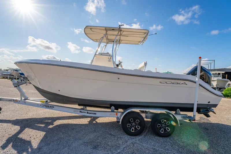 Slide: The Image of 2022 Cobia 237 Center Console boat dashboard with Garmin navigation system. - 5