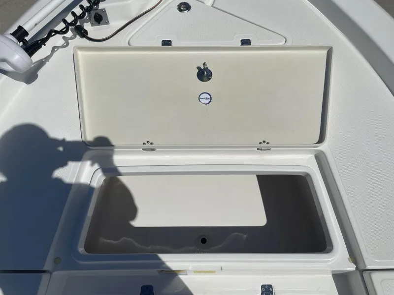 Slide: The Image of Open storage compartment on 2015 NauticStar 2200 Sport boat. - 22