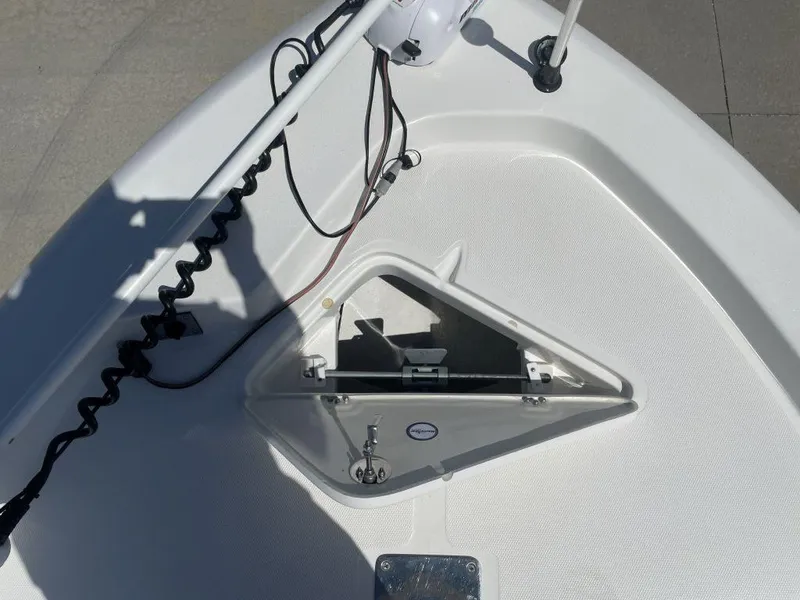 Slide: The Image of 2015 NauticStar 2200 Sport boat bow with open anchor compartment. - 23