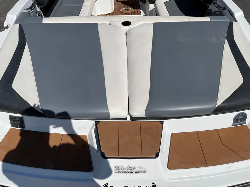 Slide: The Image of 2021 Axis T22 boat with gray and white seating, teak flooring, and sleek design. - 16