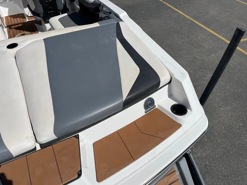 Slide: The Image of 2021 Axis T22 boat interior with cushioned seating and cup holders. - 18