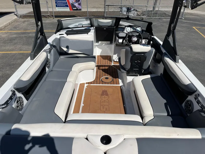 Slide: The Image of 2021 Axis T22 boat interior with spacious seating and modern dashboard. - 19