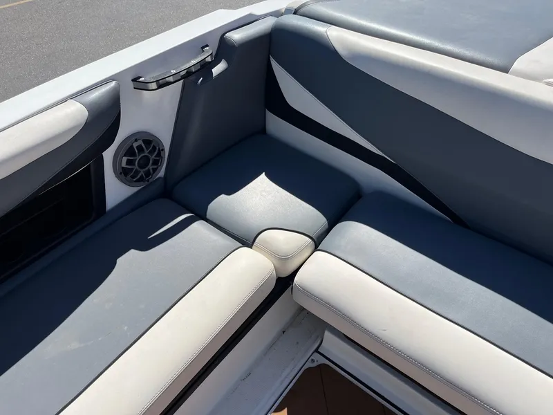 Slide: The Image of 2021 Axis T22 boat interior with gray and white cushioned seating. - 22