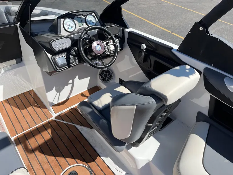 Slide: The Image of 2021 Axis T22 boat interior with modern dashboard and comfortable seating. - 27