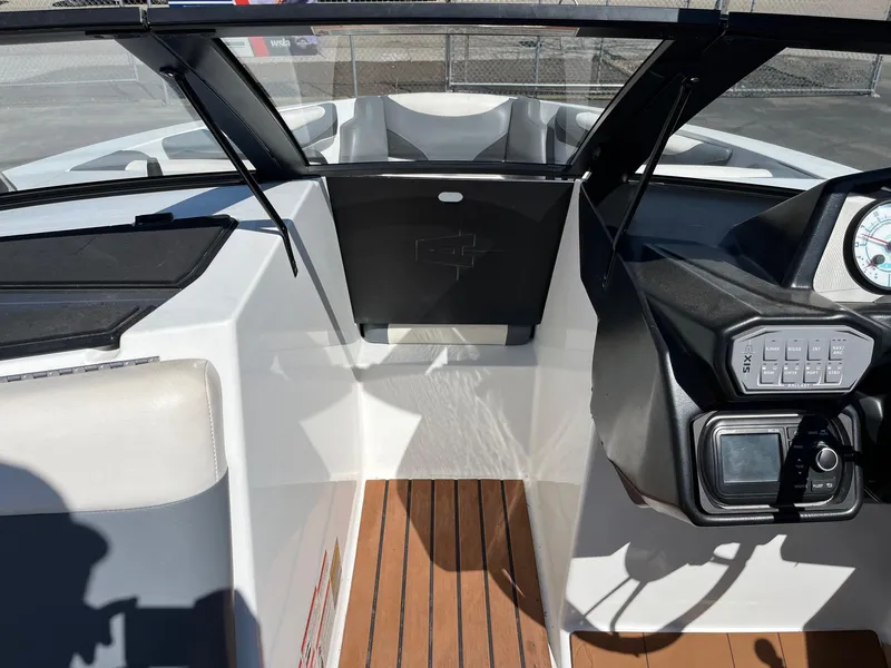 Slide: The Image of 2021 Axis T22 boat interior with dashboard and wooden flooring. - 29