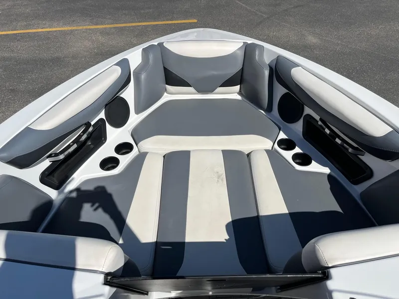 Slide: The Image of Interior of 2021 Axis T22 boat with gray and white seating and cup holders. - 30