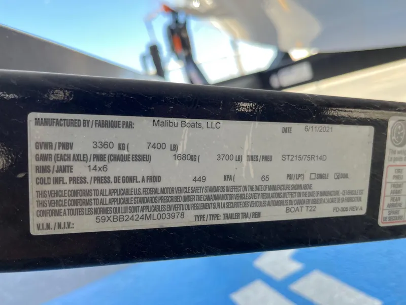 Slide: The Image of Label on Axis T22 trailer by Malibu Boats, showing specifications and compliance details. - 39