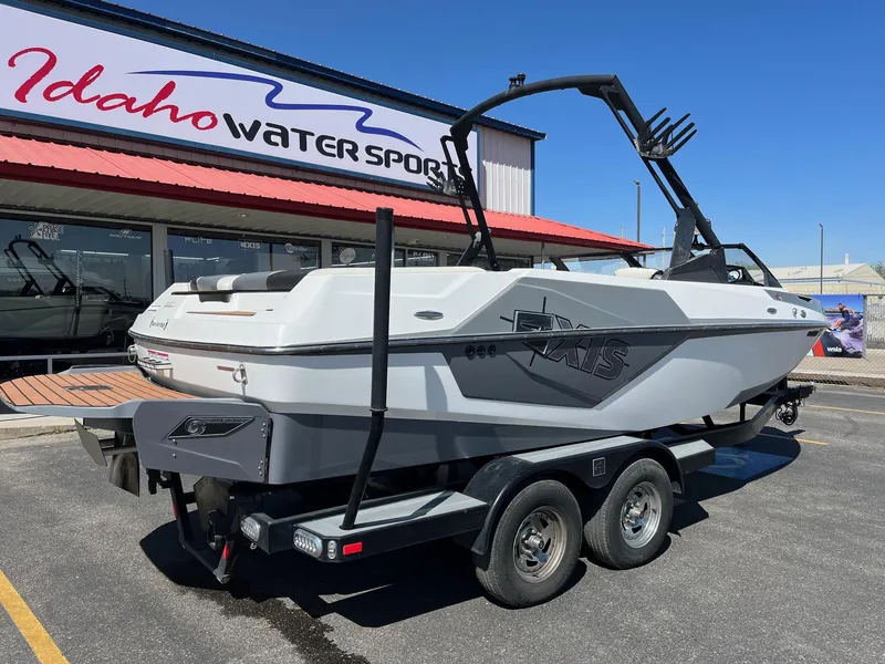 Slide: The Image of 2021 Axis T22 boat on trailer at Idaho Water Sports dealership. - 4