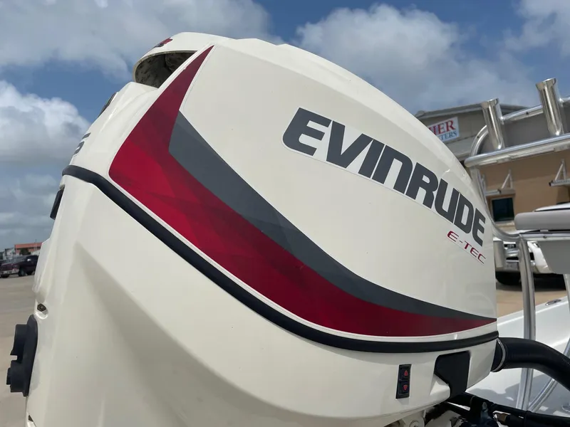 Slide: The Image of Evinrude E-TEC outboard motor on 2020 Shallow Sport 18 Sport boat, close-up view. - 10