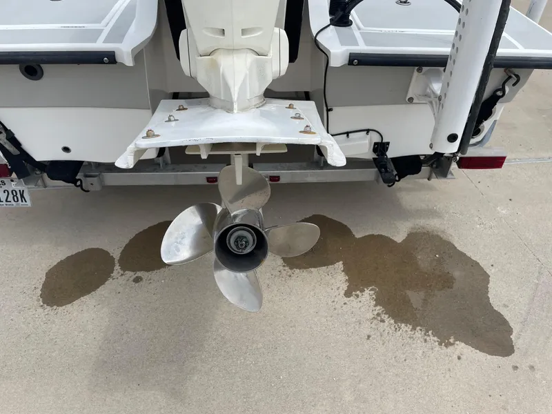 Slide: The Image of Propeller of a 2020 Shallow Sport 18 Sport boat with water stains on concrete. - 11