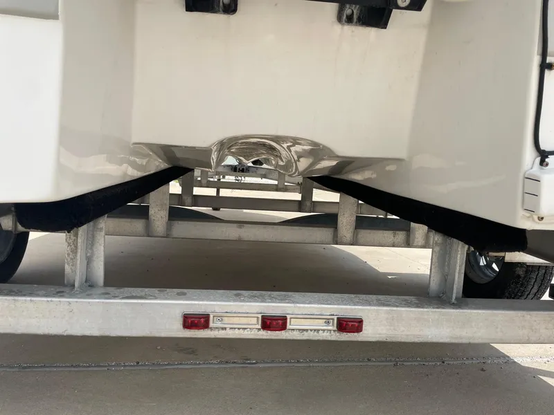 Slide: The Image of 2020 Shallow Sport 18 Sport boat on trailer, rear view showing hull and trailer details. - 14