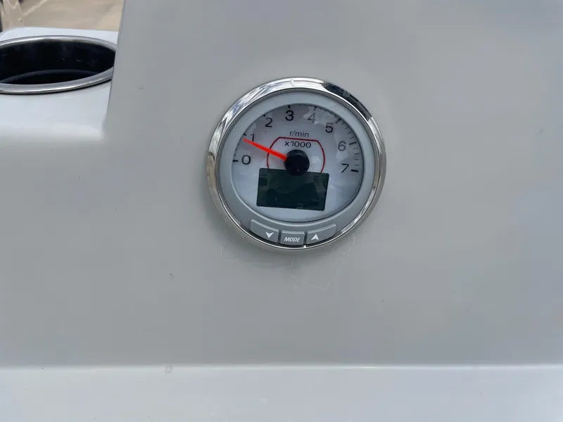 Slide: The Image of Tachometer on 2020 Shallow Sport 18 Sport boat dashboard, displaying RPM. - 26