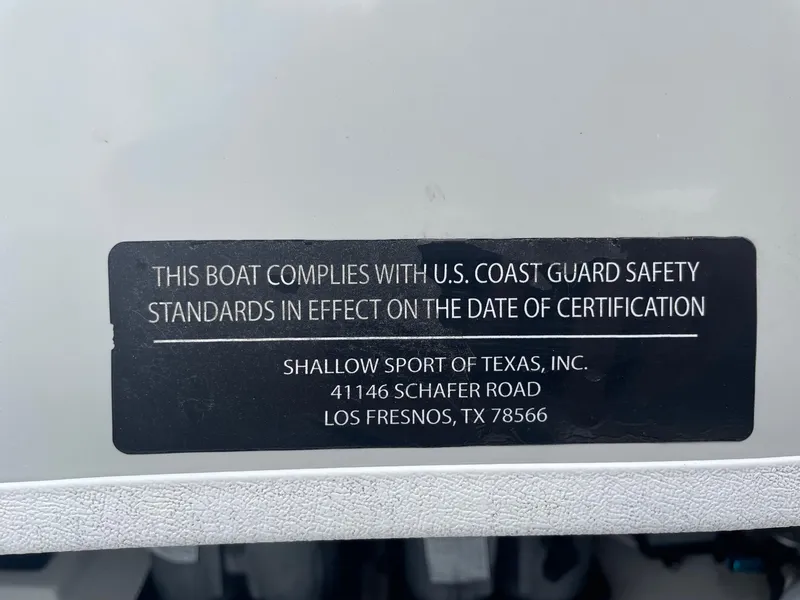 Slide: The Image of 2020 Shallow Sport 18 Sport boat compliance label with U.S. Coast Guard safety standards. - 27