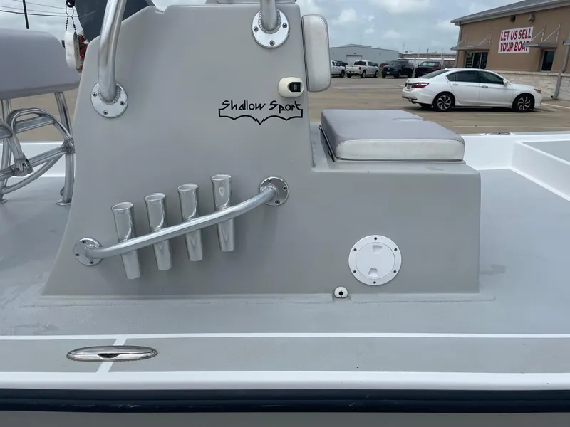 Slide: The Image of 2020 Shallow Sport 18 Sport boat interior with rod holders and seating. - 28