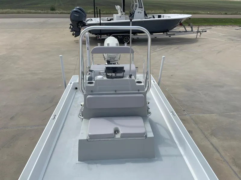 Slide: The Image of 2020 Shallow Sport 18 Sport boat on trailer, viewed from above, in a parking area. - 32