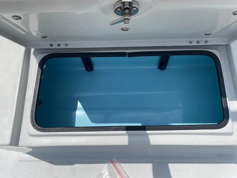 Slide: The Image of Open storage compartment on 2020 Shallow Sport 18 Sport boat. - 33