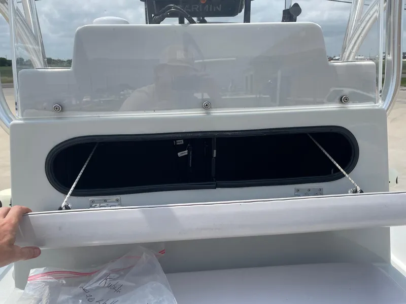 Slide: The Image of 2020 Shallow Sport 18 Sport boat console with open storage compartment. - 34