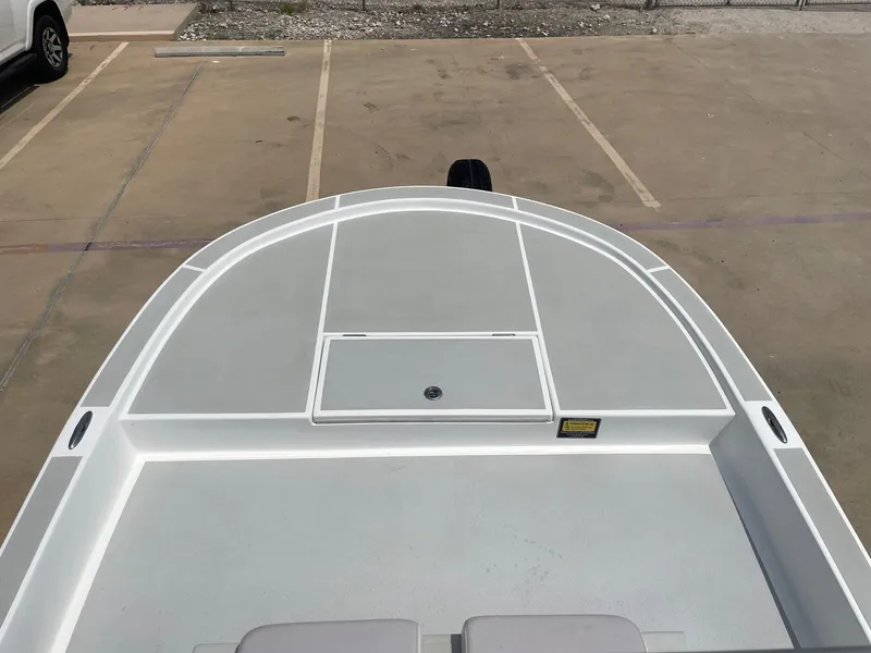 Slide: The Image of 2020 Shallow Sport 18 Sport boat deck in a parking lot. - 35