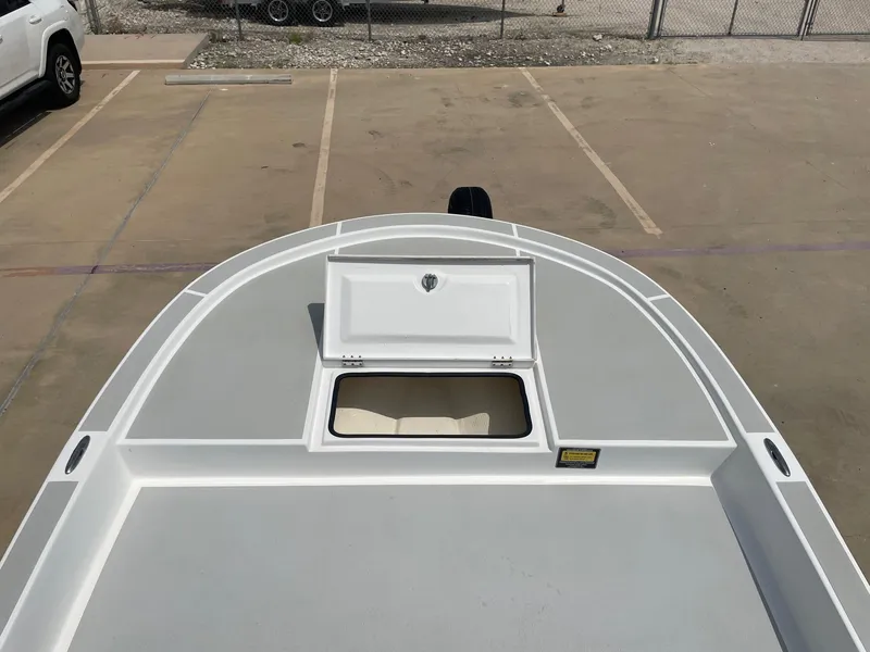 Slide: The Image of 2020 Shallow Sport 18 Sport boat deck with open storage compartment. - 36