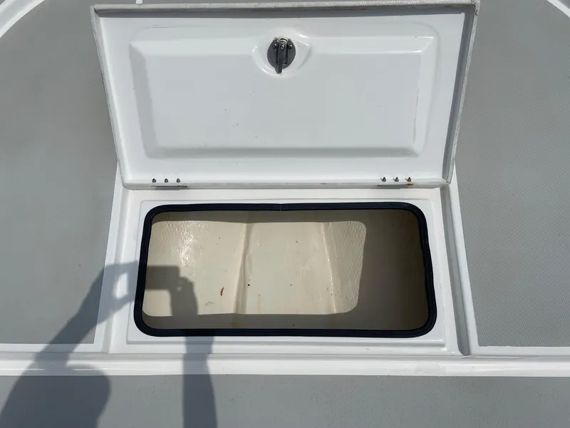 Slide: The Image of Open storage compartment on a 2020 Shallow Sport 18 Sport boat. - 37