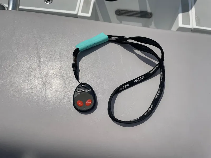 Slide: The Image of Remote control with lanyard on Shallow Sport 18 Sport boat, 2020 model. - 38