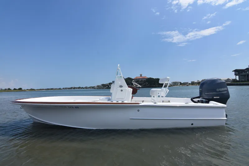 Slide: The Image of 2013 Chaos 21 Tarpon Bay boat on calm water under blue sky. - 10