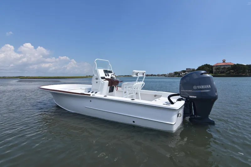 Slide: The Image of 2013 Chaos 21 Tarpon Bay boat with Yamaha outboard engine on calm water. - 11