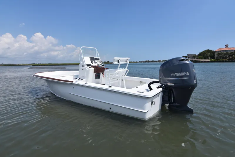 Slide: The Image of 2013 Chaos 21 Tarpon Bay boat with Yamaha engine on calm water. - 12
