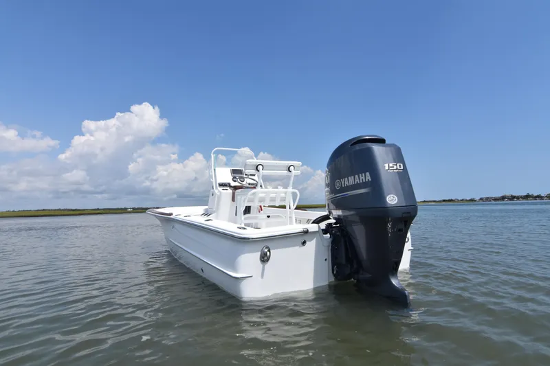 Slide: The Image of 2013 Chaos 21 Tarpon Bay boat with Yamaha 150 engine in calm waters. - 13