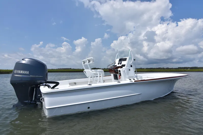 Slide: The Image of 2013 Chaos 21 Tarpon Bay boat with Yamaha engine on calm water. - 2