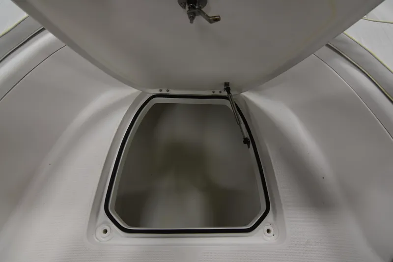 Slide: The Image of Open storage compartment on a 2013 Chaos 21 Tarpon Bay boat. - 26
