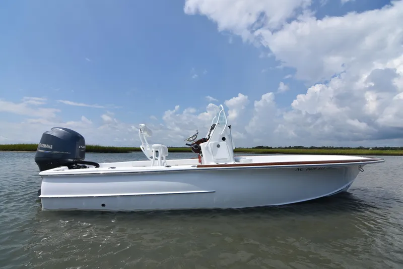 Slide: The Image of 2013 Chaos 21 Tarpon Bay boat on water under blue sky. - 3