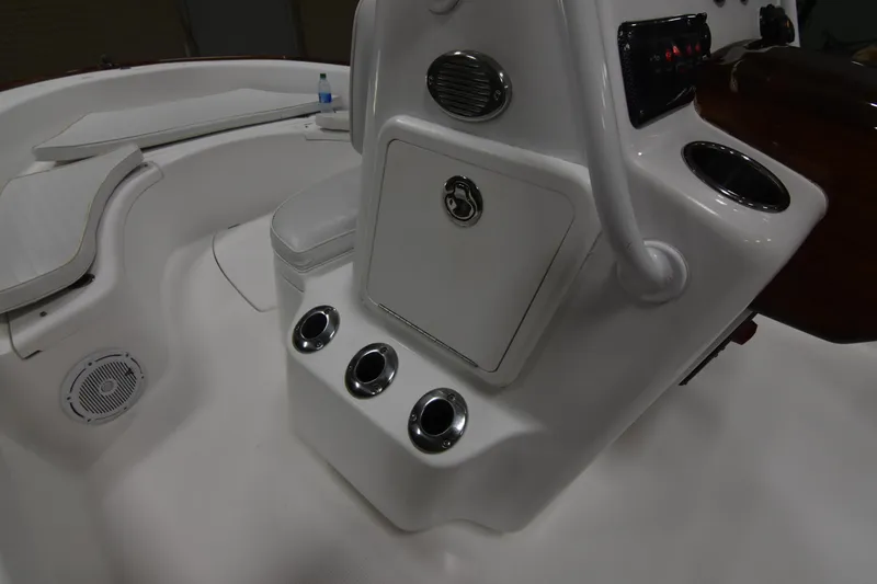 Slide: The Image of 2013 Chaos 21 Tarpon Bay boat console with cup holders and storage compartment. - 31