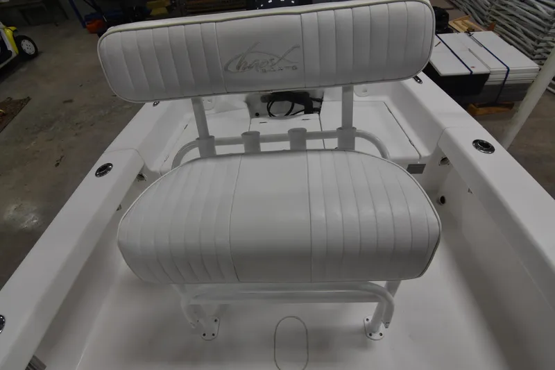 Slide: The Image of 2013 Chaos 21 Tarpon Bay boat with white cushioned seating. - 36