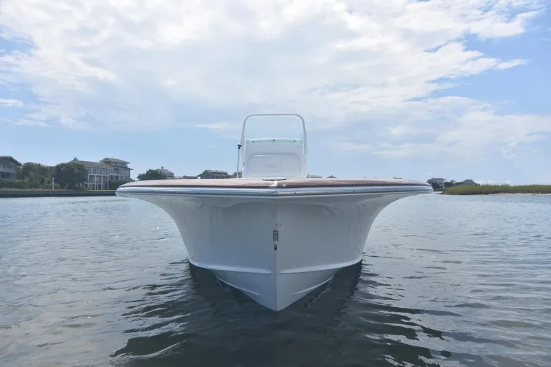 Slide: The Image of 2013 Chaos 21 Tarpon Bay boat on calm water under cloudy sky. - 6