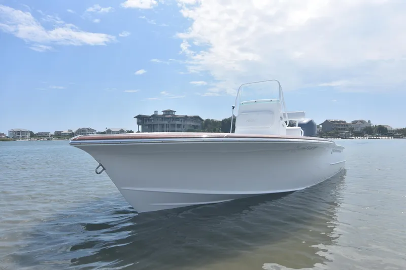 Slide: The Image of 2013 Chaos 21 Tarpon Bay boat on calm water, clear sky background. - 7