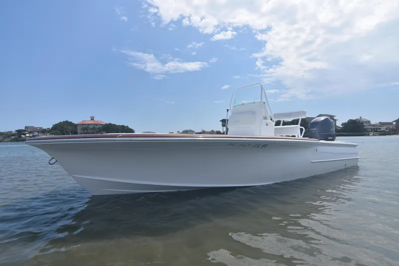 Slide: The Image of 2013 Chaos 21 Tarpon Bay boat on calm water under a partly cloudy sky. - 8