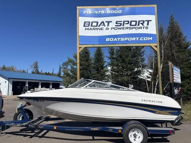 Slide: The Image of 2000 Crownline 180 BR boat on trailer at Boat Sport Marine dealership. - 1
