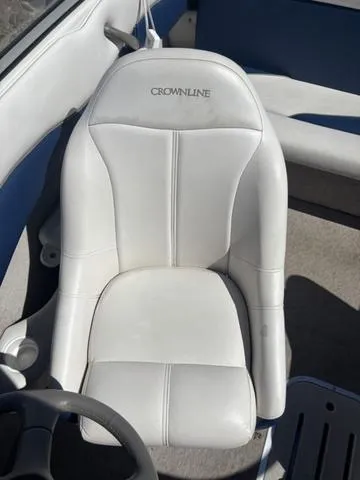 Slide: The Image of White leather seat in a 2000 Crownline 180 BR boat interior. - 11