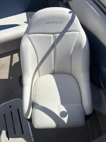 Slide: The Image of White leather seat in a 2000 Crowline 180 BR boat. - 12