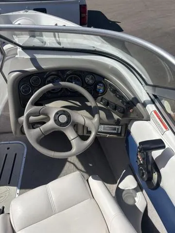 Slide: The Image of 2000 Crowline 180 BR boat dashboard with steering wheel and instrument panel. - 14